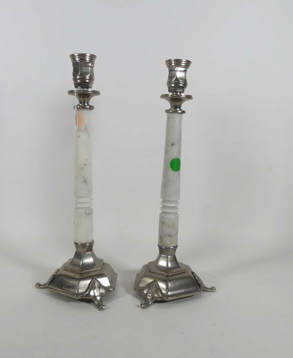 Lot 32 - A pair of metal mounted marble candlesticks,...