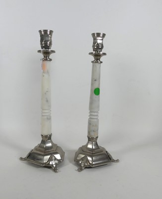 Lot 32 - A pair of metal mounted marble candlesticks,...