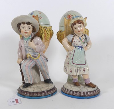 Lot 38 - A pair of continental pottery figural jars and...
