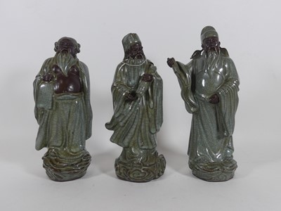 Lot 51 - Three Chinese crackle glazed stoneware figures...