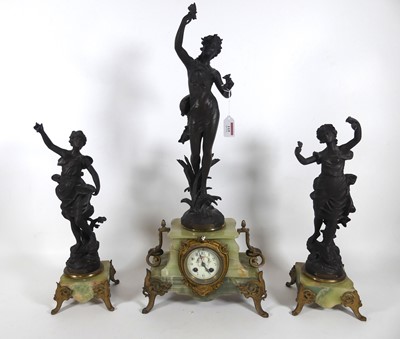Lot 115 - A late 19th century French three-piece clock...