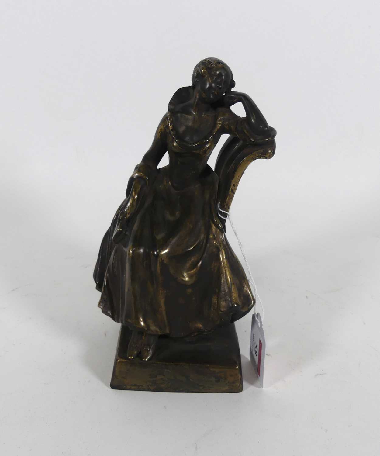 Lot 59 - A bronze figure of a lady seated in a chair, h....