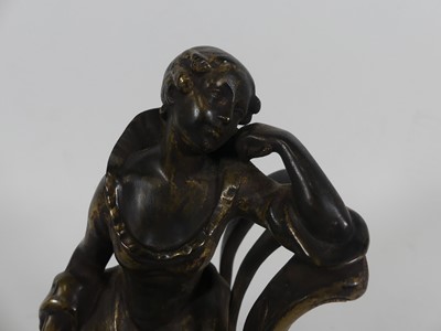Lot 59 - A bronze figure of a lady seated in a chair, h....