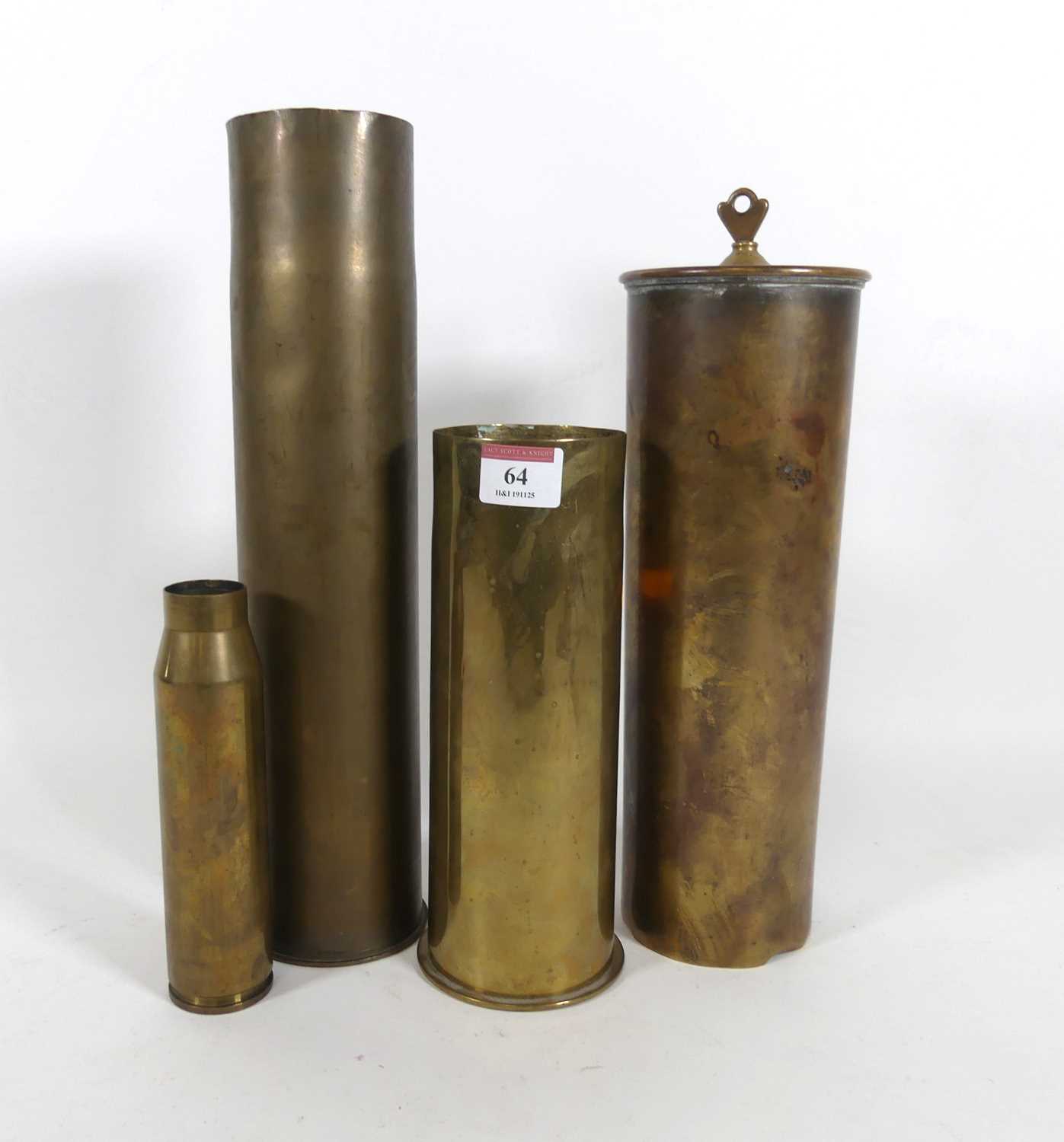 Lot 64 - A group of four brass shell cases, largest h.35cm