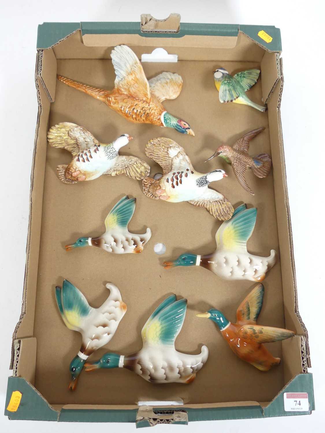 Lot 74 - A collection of pottery wall plaques of birds,...
