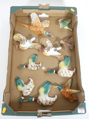 Lot 74 - A collection of pottery wall plaques of birds,...
