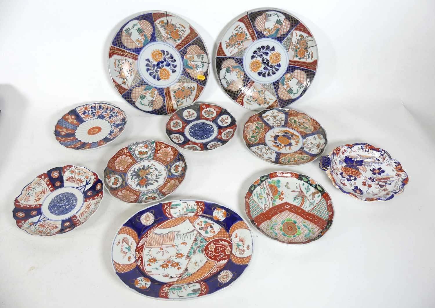 Lot 79 - A collection of Japanese imari dishes, largest...