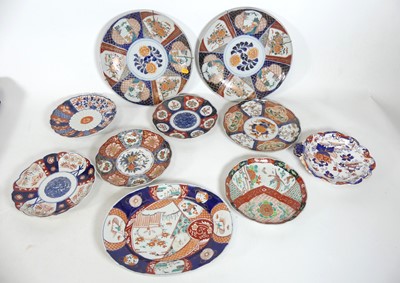 Lot 79 - A collection of Japanese imari dishes, largest...