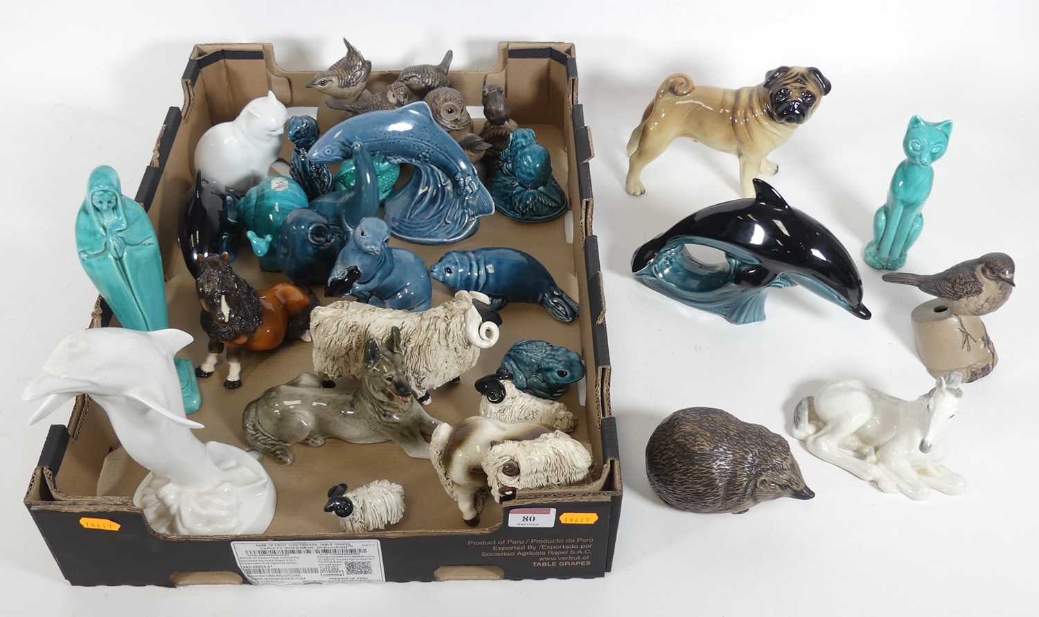 Lot 80 - A collection of figures of animals, to include...