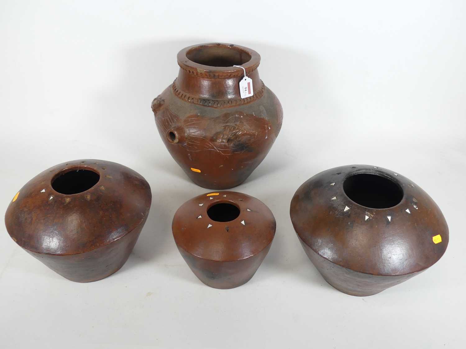 Lot 94 - A collection of African pottery, to include a...