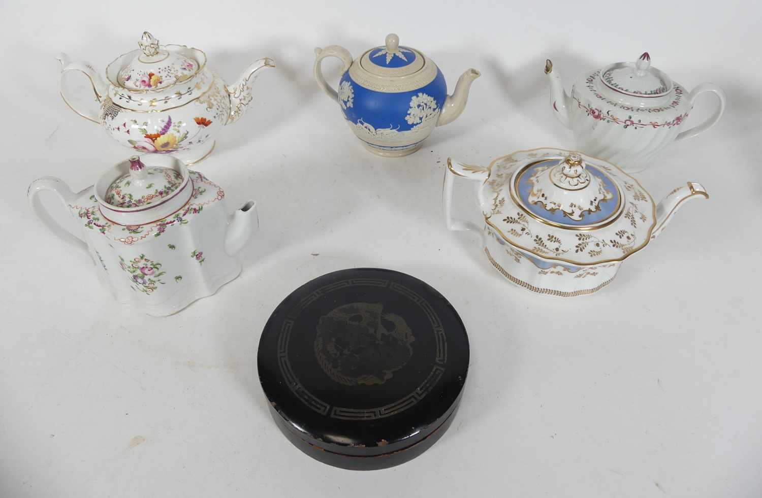 Lot 102 - A group of five 19th century teapots, to...