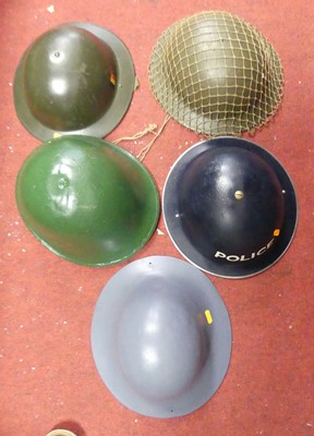 Lot 181 - A WWII ARP policeman's helmet, together with...