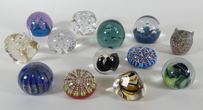 Lot 222 - A collection of studio glass paperweights, to...