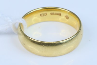 Lot 344 - A modern 18ct gold court shaped wedding band,...