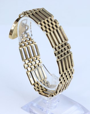 Lot 369 - A 9ct gold gate link bracelet, with heart...