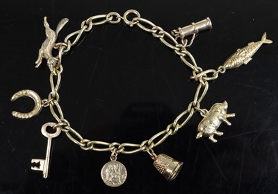 Lot 373 - A 9ct gold bracelet containing assorted...