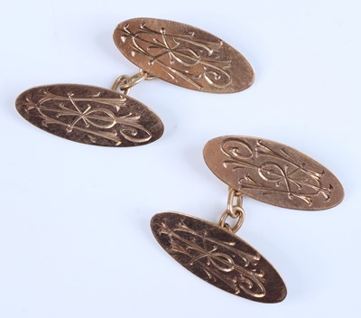 Lot 388 - A pair of 9ct gold oval and engraved cufflinks,...