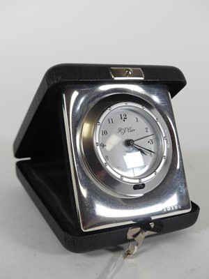 Lot 337 - A modern silver clad travel clock by RJ Carr...