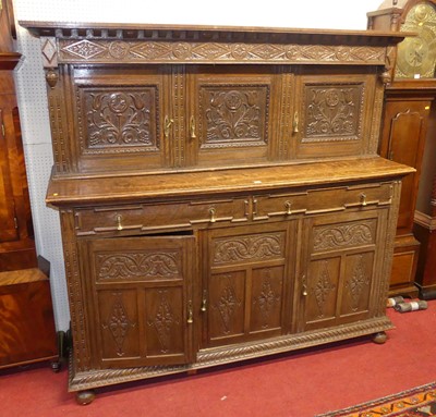 Lot 1218 - A joined and floral relief carved oak court...