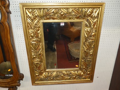 Lot 1224 - A decorative floral gilt wood deep framed...