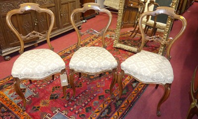 Lot 1240 - A set of three mid-Victorian walnut balloon...