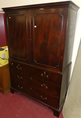 Lot 1264 - A 19th century mahogany linen press, the twin...