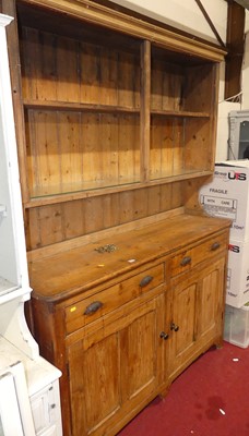 Lot 1281 - A late Victorian pine kitchen dresser, having...