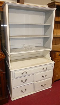 Lot 1282 - A white painted pine dresser, having three...
