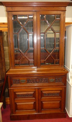 Lot 1156 - A late Victorian walnut secretaire bookcase,...