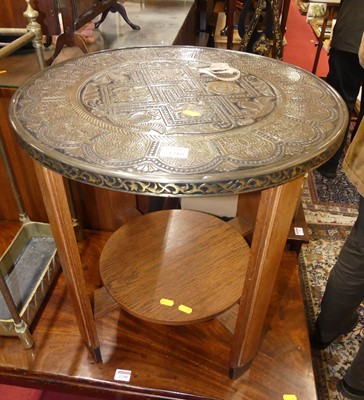 Lot 1289 - An Art Deco Dutch oak and embossed brass...