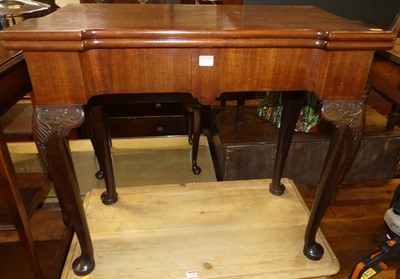 Lot 1297 - A mid-18th century mahogany fold-over games...