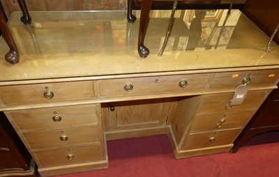 Lot 1333 - A Victorian pine kneehole writing desk, having...