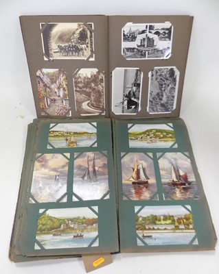 Lot 574 - An early 20th century postcard album, contents...