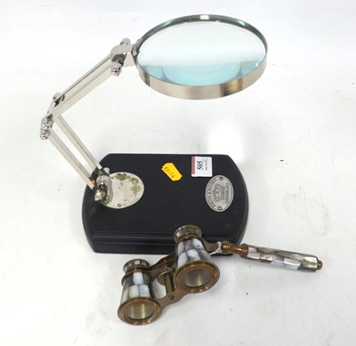 Lot 505 - A table magnifying glass on adjustable chrome...