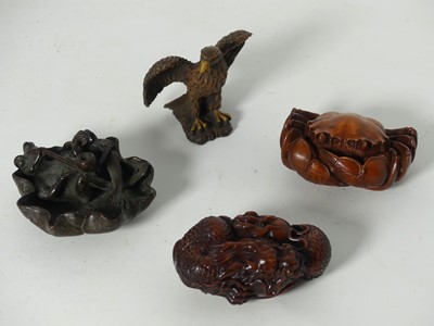 Lot 512 - A reproduction Japanese carved wooden okimono...