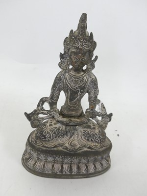 Lot 527 - A Thai patinated figure of a seated Buddha on...