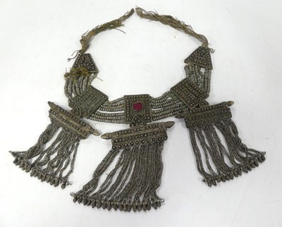 Lot 566 - A Bedouin white metal necklace, the central...