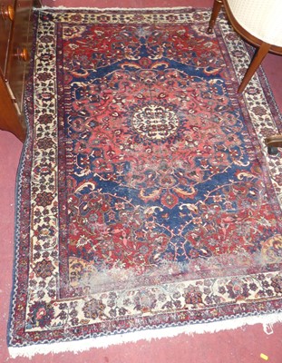 Lot 1246 - A blue, red and pale ground Kazak rug, with...