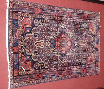 Lot 1250 - A Persian woollen red and blue ground Hamadan...