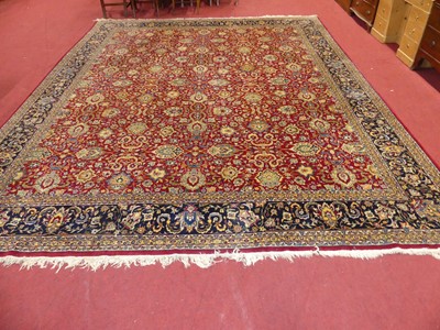 Lot 1255 - A large Persian red and blue ground woollen...