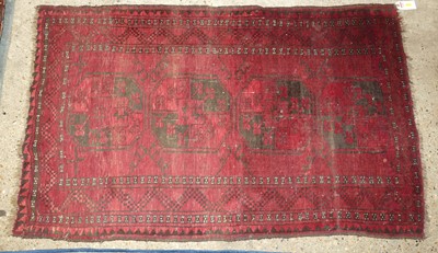 Lot 1258 - A Persian woollen red ground Bokhara rug