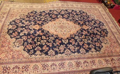 Lot 1210 - A blue, red and cream ground machine woven...