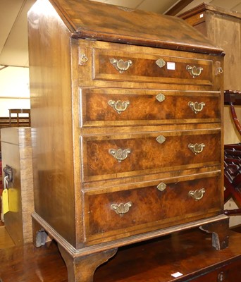 Lot 1349 - A figured walnut and crossbanded slopefront...