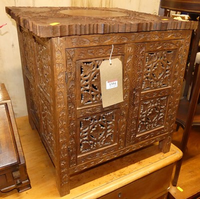 Lot 1354 - An Indian relief carved teak box low...