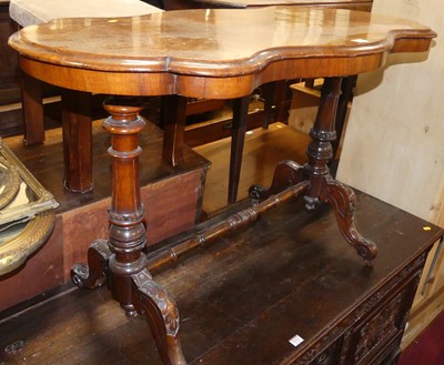Lot 1373 - A mid-Victorian figured walnut shaped top...