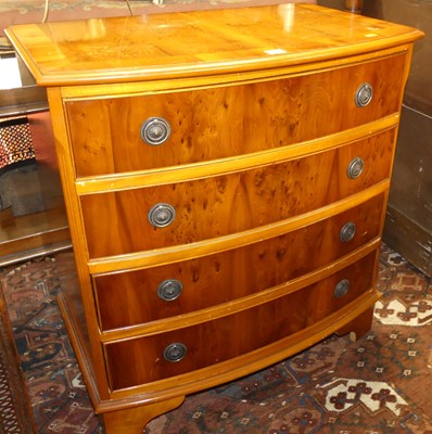 Lot 1390 - A contemporary yew bow front chest of four...