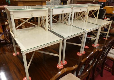 Lot 1397 - A set of four white painted two-tier bedside...