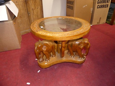 Lot 1405 - An Indian relief carved teak circular glass...