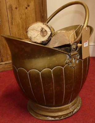Lot 1408 - An early 20th century brass helmet coal...