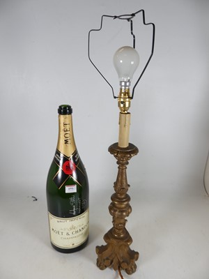 Lot 694 - A carved softwood and gilt painted table lamp,...